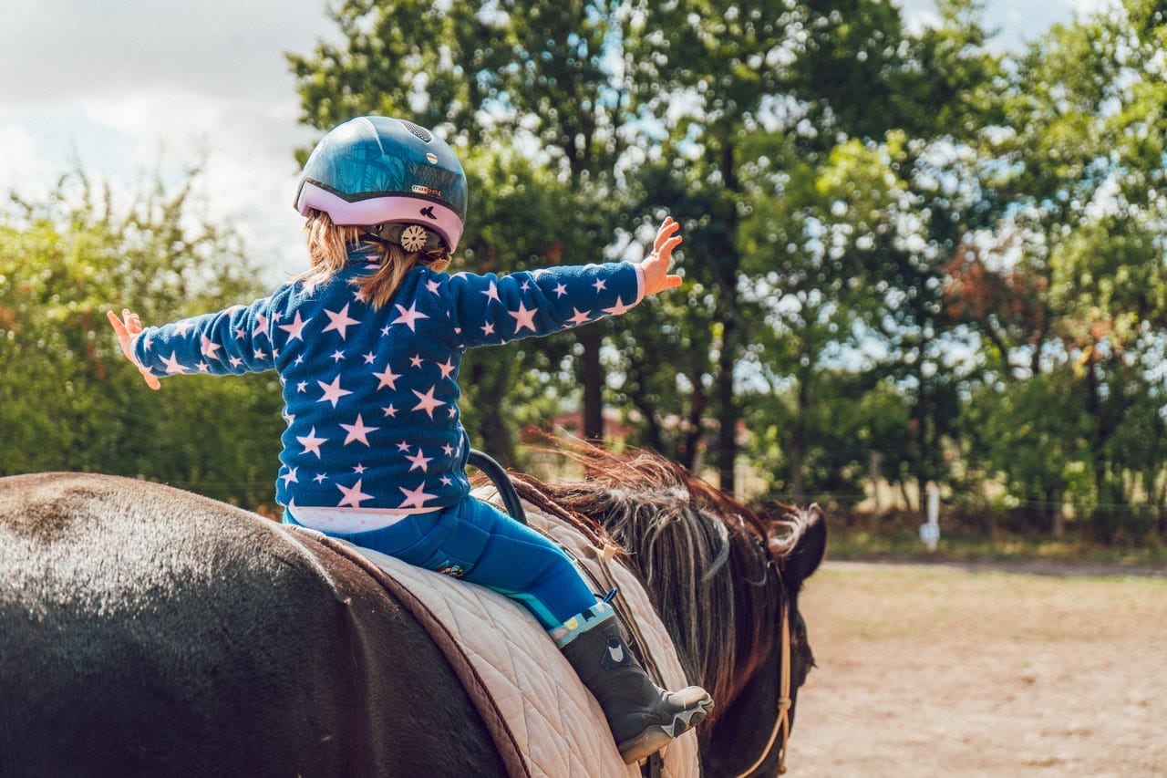 child horseback riding